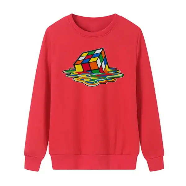 Sweat rouge avec un puzzle Rubik's en train de tomber dans l'eau, illustrant un motif coloré et ludique. Parfait pour les amateurs de science et de décoration originale.