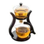Infuseur à thé en bois et verre avec support, idéal pour préparer des thés et infusions, design élégant et pratique pour une utilisation quotidienne.