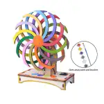 Roue de couleurs en bois pour activités artistiques et éducatives, accompagnée de pinceaux et de peinture pour créer des œuvres colorées.
