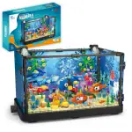 Aquarium en kit pour enfants avec poissons colorés, plantes aquatiques et décorations, idéal pour apprendre la vie marine de manière ludique.