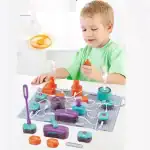 Jeu éducatif pour enfant avec circuit électrique interactif, comprenant des composants colorés pour apprendre l'électricité de manière ludique.