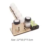 Balancier à billes en bois avec moteur électrique et balles blanches pour expérience scientifique éducative.