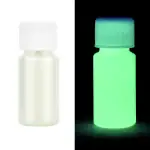 Flacon de laboratoire avec capuchon lumineux, visible dans l'obscurité, utilisé pour expériences scientifiques ou décoration.