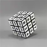 Cube puzzle noir et blanc avec chiffres et lettres, décoration de style scientifique ou éducatif.