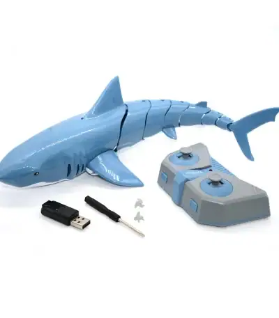 Requin robot éducatif en plastique bleu avec télécommande, clé USB et accessoires pour apprentissage interactif.