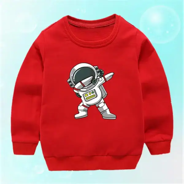 Sweatshirt rouge pour enfant avec un motif d'astronaute en style cartoon, parfait pour les amateurs d'espace et de science-fiction.