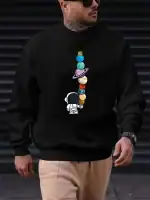 Sweatshirt noir avec motif de planètes colorées empilées et un petit astronaute, idéal pour les amateurs de science et d'astronomie. Confortable et tendance, parfait pour un look décontracté.