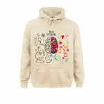 Sweat à capuche neurosciences avec illustration du cerveau coloré et éléments artistiques, parfait pour les passionnés de sciences et d'art.